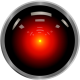 HAL9000 from 2001:A Space Odyessy. A glowing red dot on a black circle.